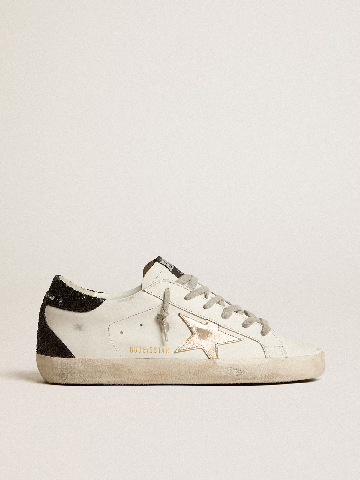 Super-Star Donna con stella oro e talloncino in glitter nero
