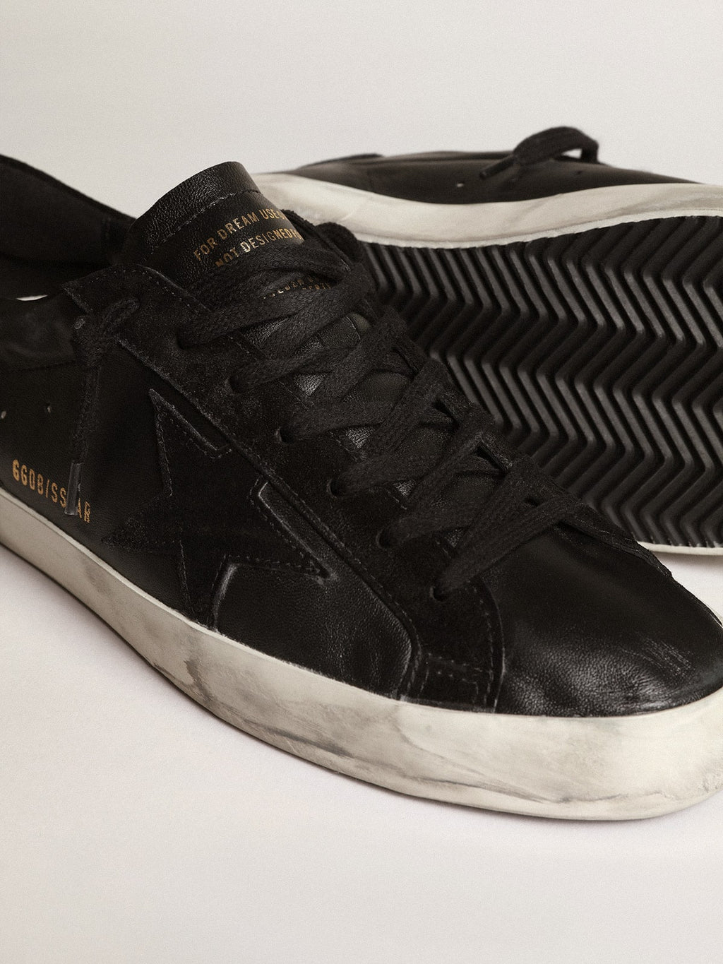 Men's Super-Star in black nappa with black suede star and heel tab