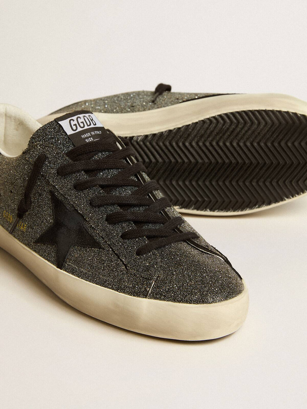 Super-Star uomo in cristalli Swarovski neri con stella in suede nero