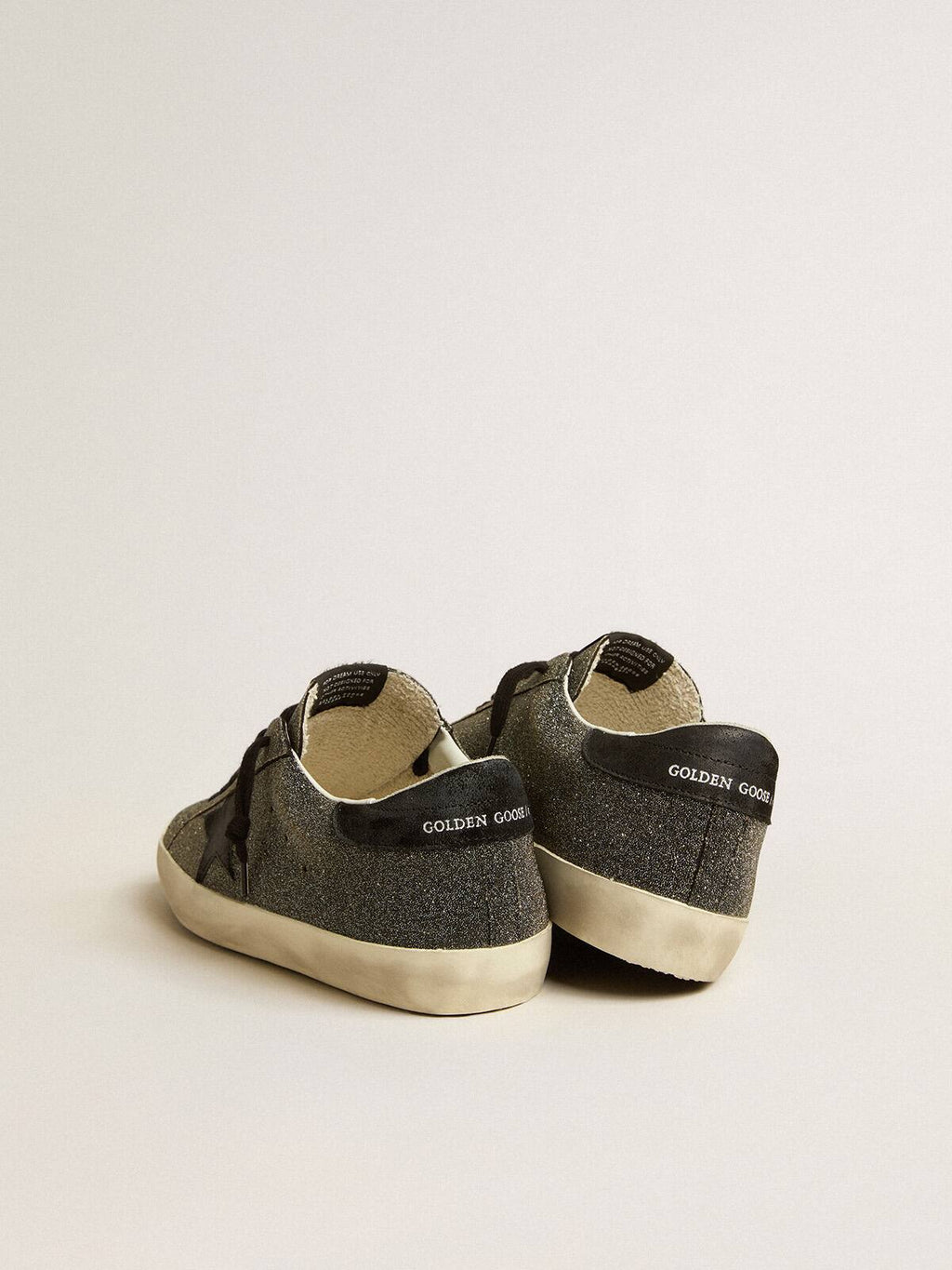 Super-Star uomo in cristalli Swarovski neri con stella in suede nero