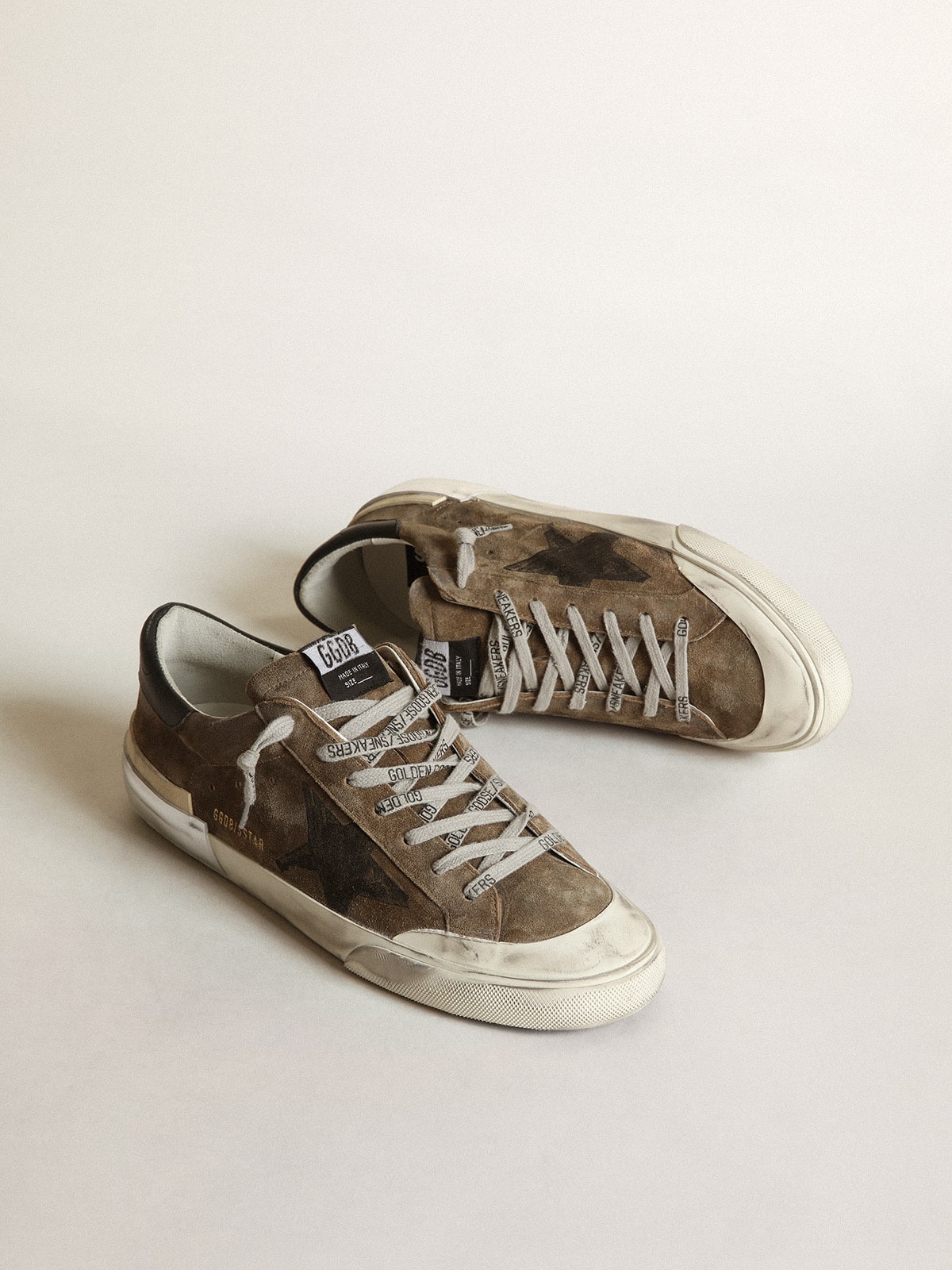 Super-Star LTD in military-green suede with screen-printed star