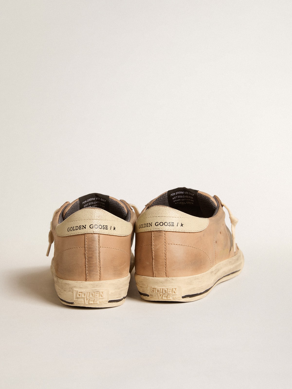 Super-Star in beige nubuck with black printed star and leather heel tab