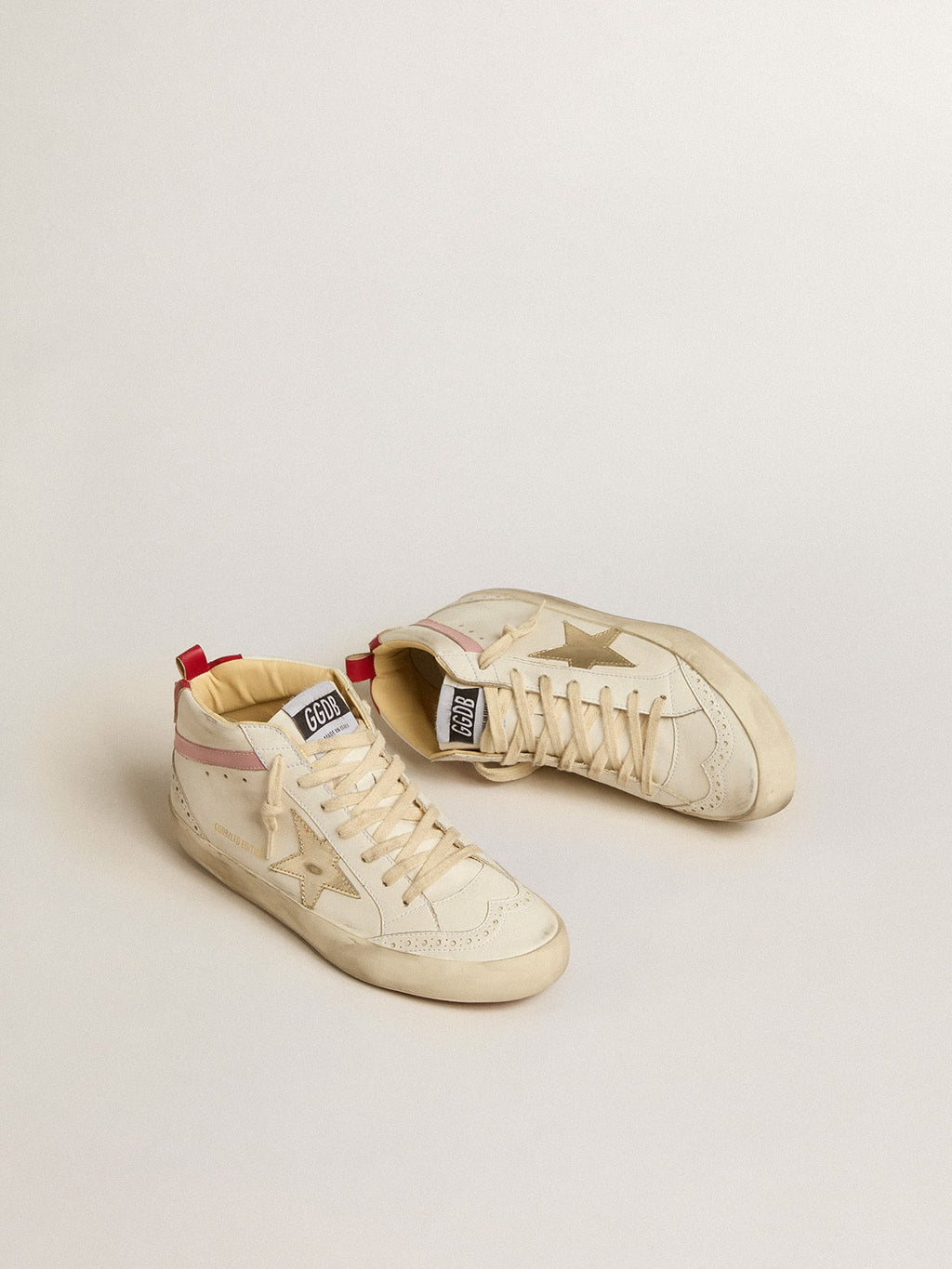 Mid Star LTD a base biologica con stella in pelle dorata e flash rosa