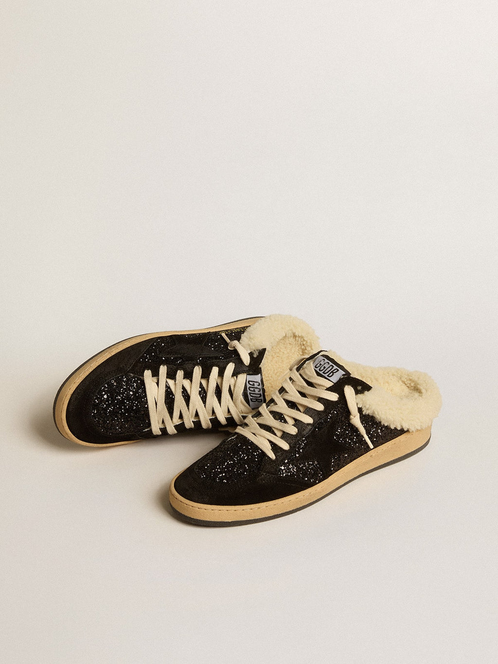 Sabot Ball Star in glitter nero con stella nera e fodera in montone