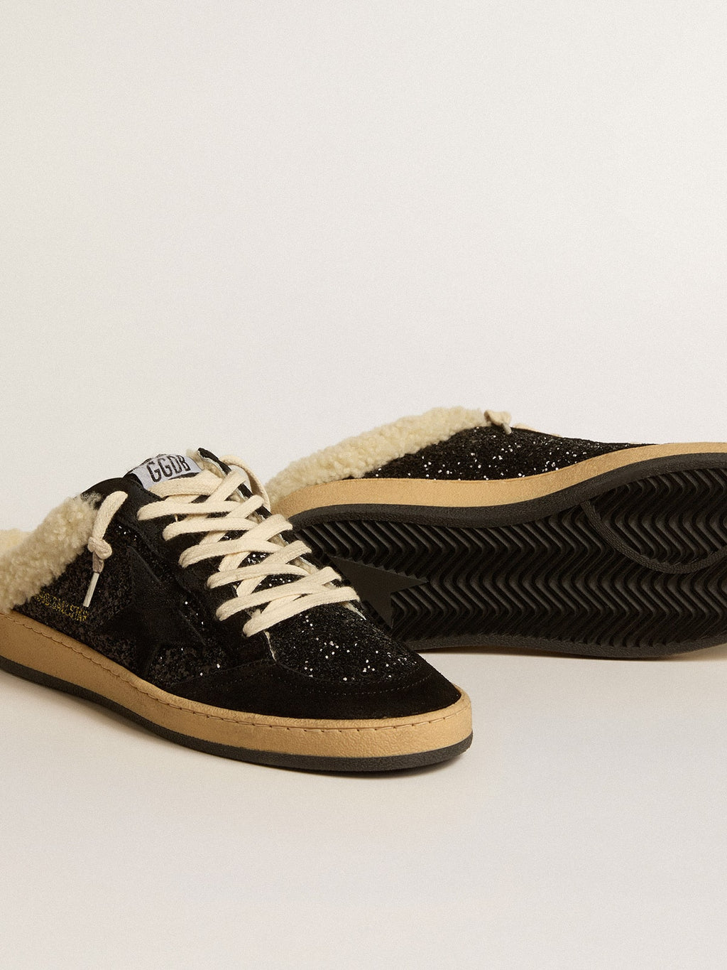 Sabot Ball Star in glitter nero con stella nera e fodera in montone